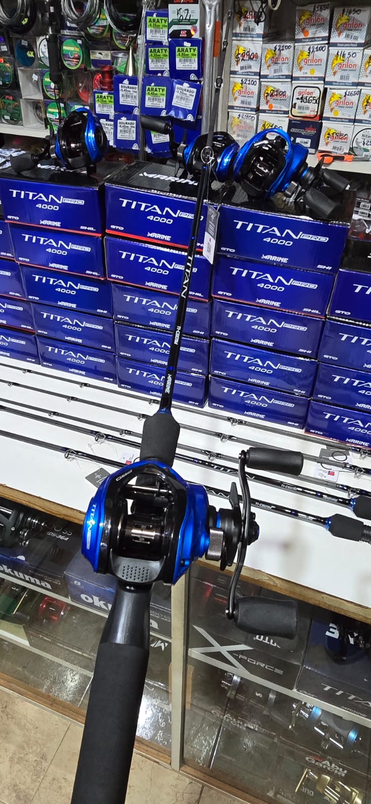 COMBO MARINE TITAN 4000 + CAÑA 12/25 LB 1T